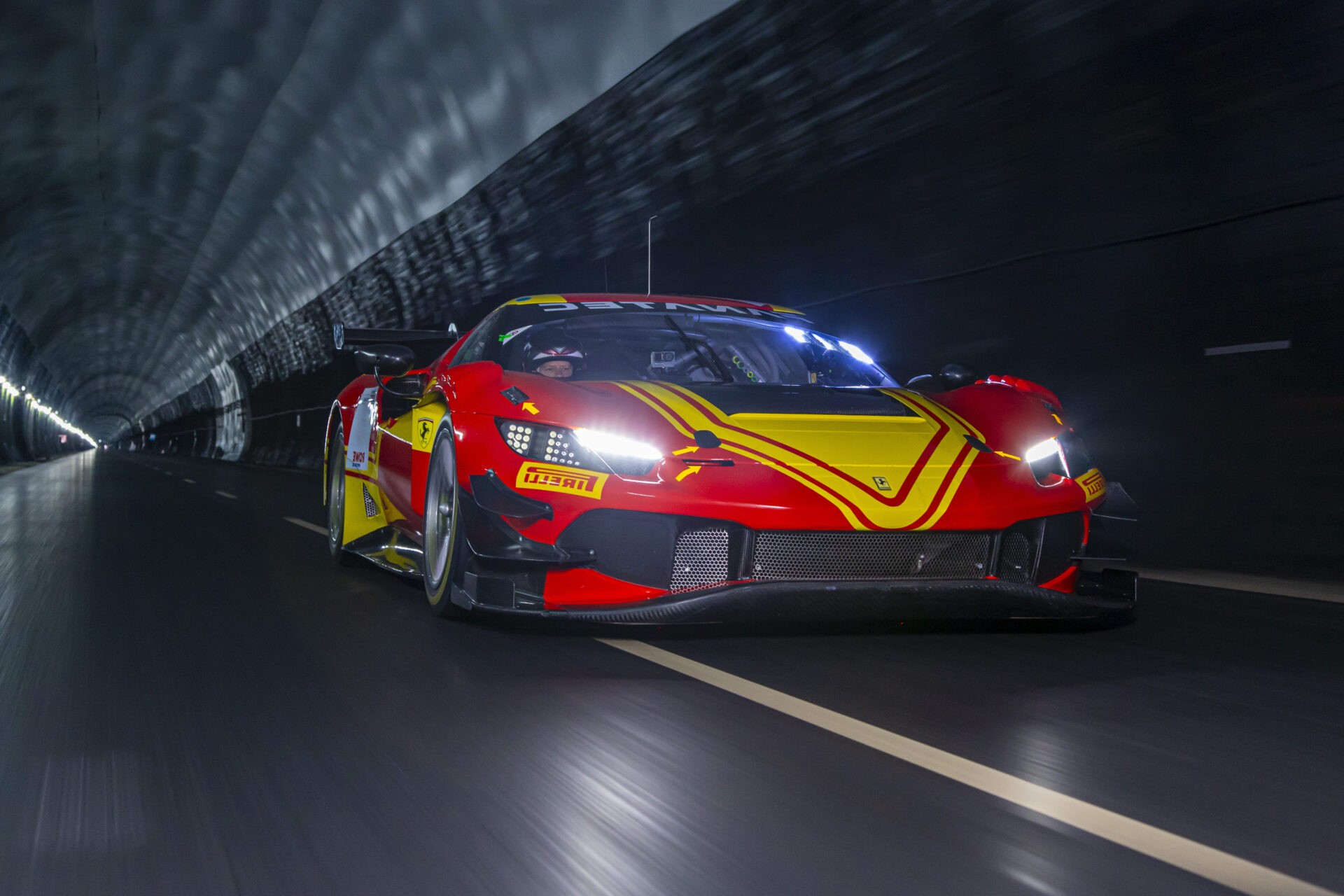 Catesby Projects Wind Tunnel Red and yellow sports car going through a tunnel, the background is blurred to show they're going at speed