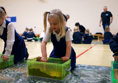 Children involved in a practical learning session
